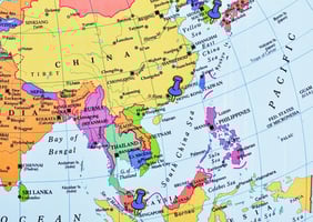 World map with pinpoints on Hong Kong, Singapore, and Korea